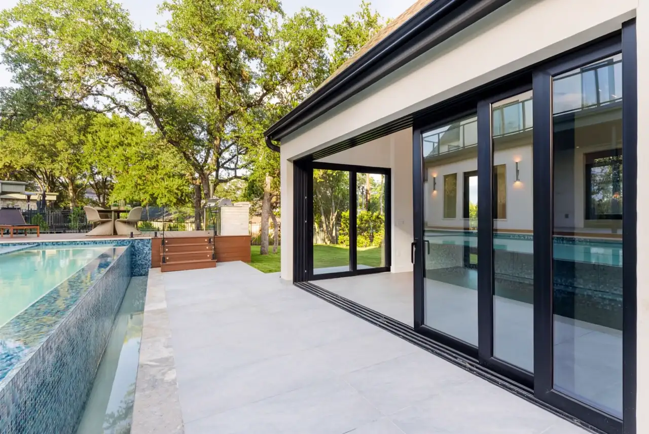 Multi-slide pocketing door open to the rear yard at 3805 Rockledge