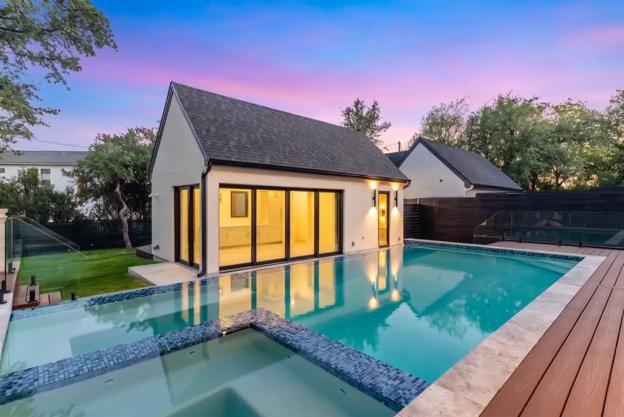 Twilight exterior of the 3805 Rockledge residence with glowing windows